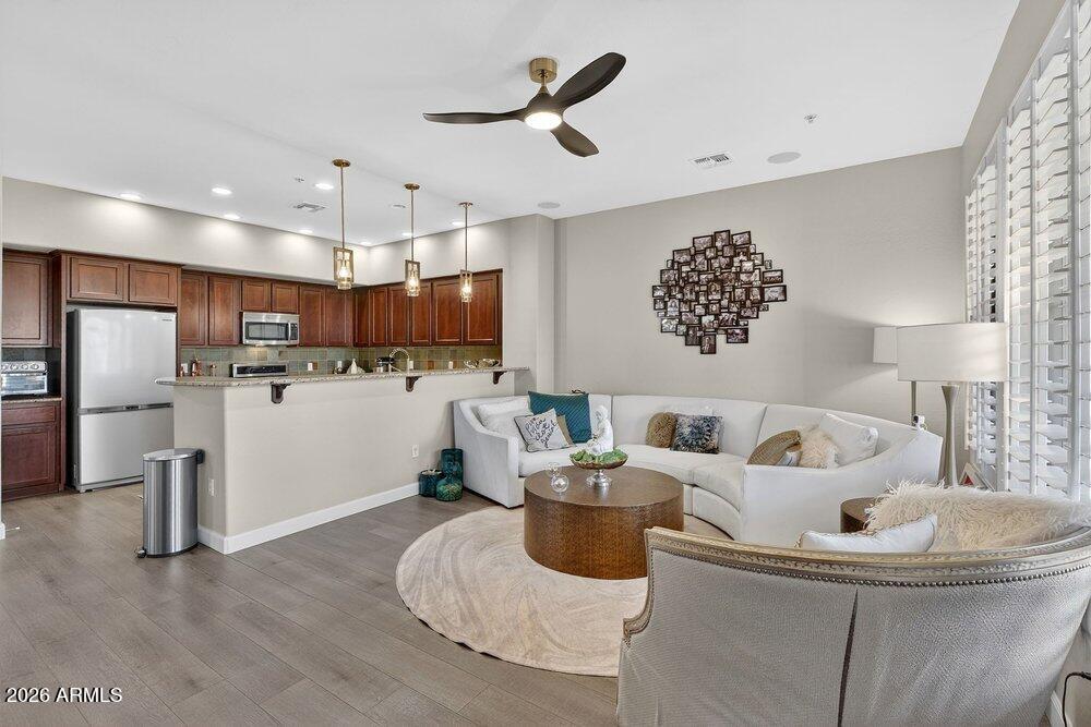 4777 South Fulton Ranch Boulevard, Unit 2035 Chandler, AZ 85248 - Photo 9 of 51 a living room with furniture and kitchen view