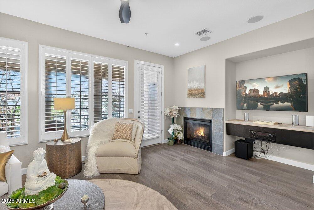 4777 South Fulton Ranch Boulevard, Unit 2035 Chandler, AZ 85248 - Photo 11 of 51 a living room with furniture and a fireplace