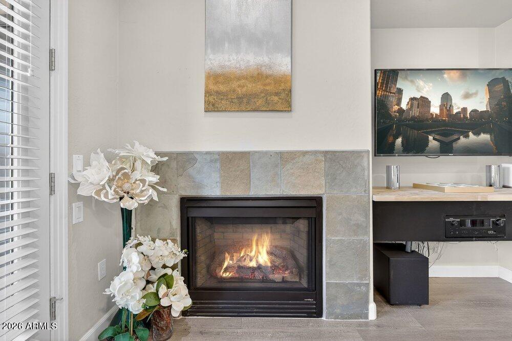 4777 South Fulton Ranch Boulevard, Unit 2035 Chandler, AZ 85248 - Photo 12 of 51 a living room with furniture and a fireplace