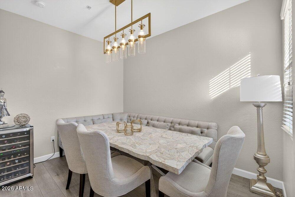 4777 South Fulton Ranch Boulevard, Unit 2035 Chandler, AZ 85248 - Photo 19 of 51 a dining room with furniture and chandelier