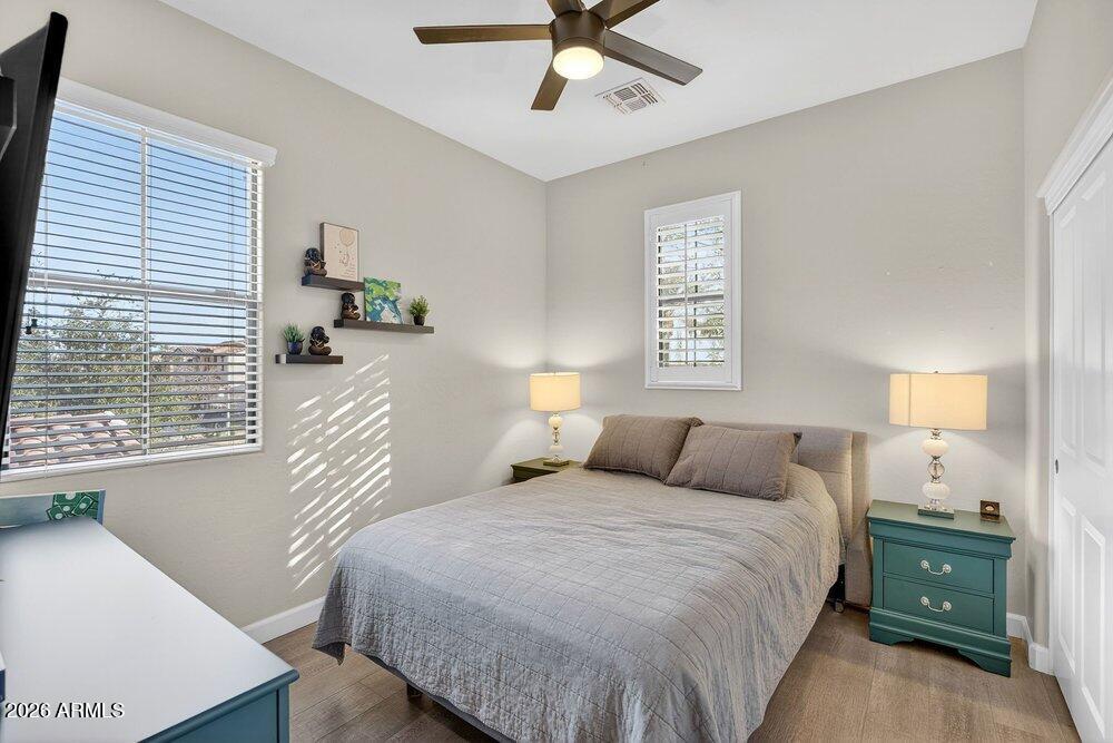 4777 South Fulton Ranch Boulevard, Unit 2035 Chandler, AZ 85248 - Photo 27 of 51 a bedroom with a bed and a window