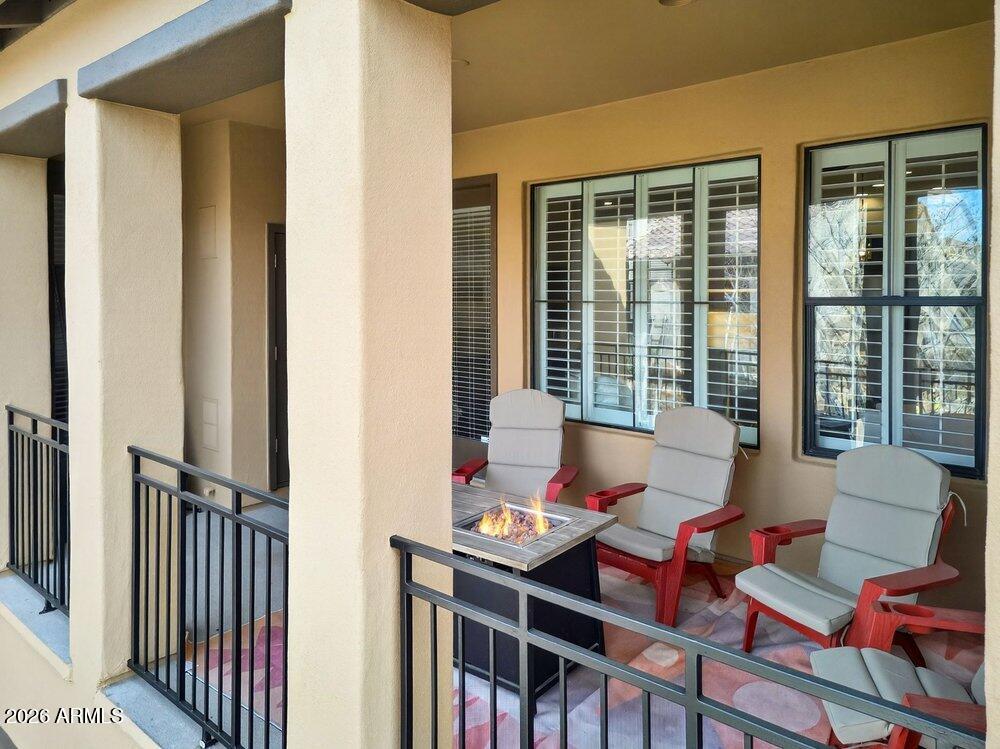 4777 South Fulton Ranch Boulevard, Unit 2035 Chandler, AZ 85248 - Photo 34 of 51 a outdoor space with patio the couches and a dining table with chairs