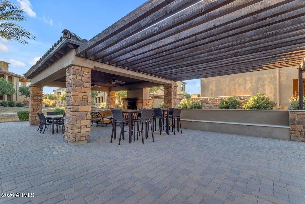4777 South Fulton Ranch Boulevard, Unit 2035 Chandler, AZ 85248 - Photo 44 of 51 a view of a patio with table and chairs and potted plants