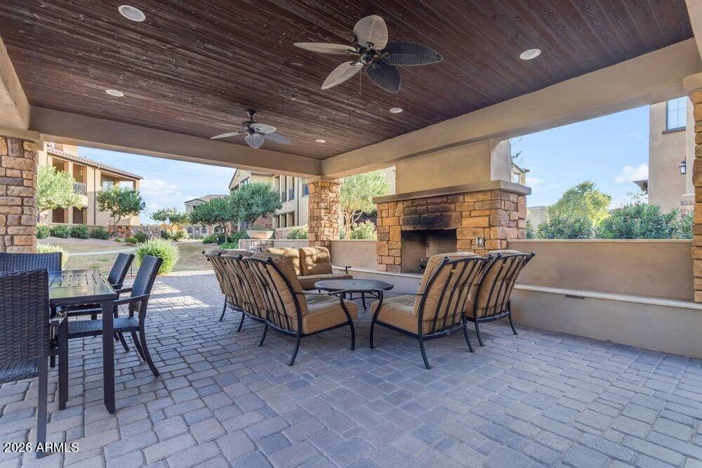 4777 South Fulton Ranch Boulevard, Unit 2035 Chandler, AZ 85248 - Photo 45 of 51 a view of a patio with a table and chairs