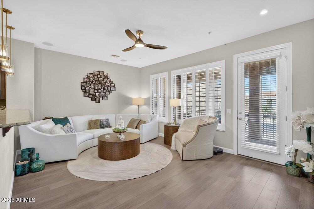 4777 South Fulton Ranch Boulevard, Unit 2035 Chandler, AZ 85248 - Photo 6 of 51 a living room with furniture and a potted plant