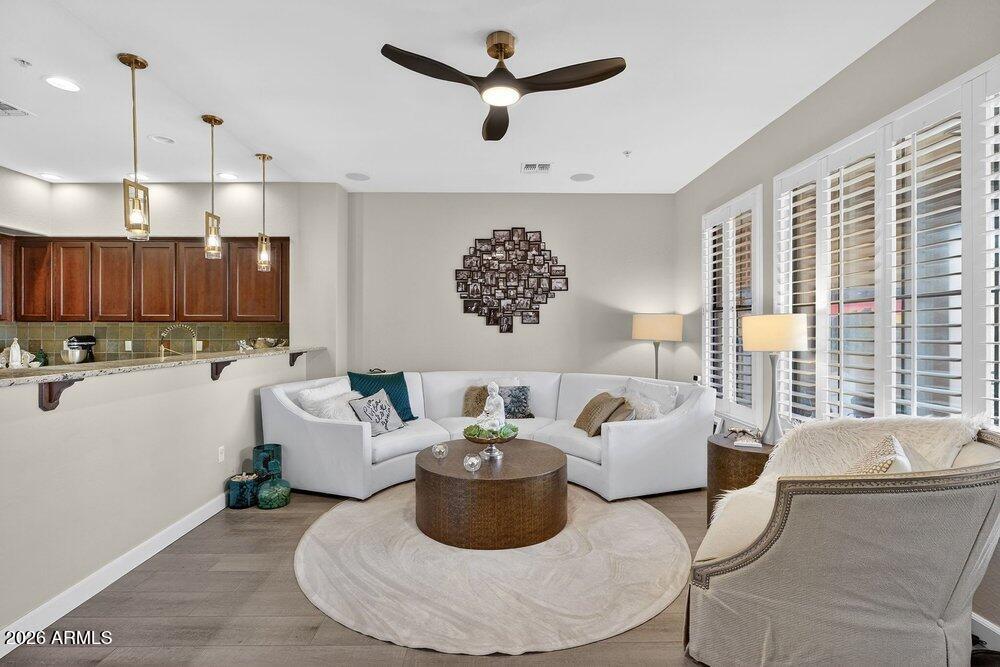 4777 South Fulton Ranch Boulevard, Unit 2035 Chandler, AZ 85248 - Photo 7 of 51 a living room with furniture and a large window