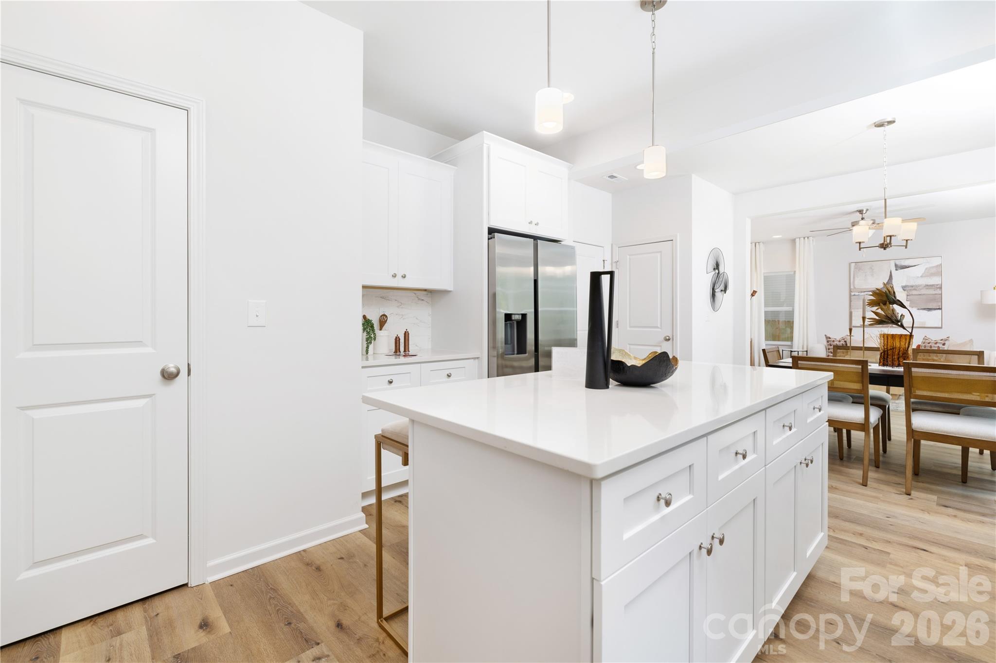 10606 Arlington Church Road Mint Hill, NC 28227 - Photo 13 of 26 a kitchen with kitchen island a sink appliances and cabinets