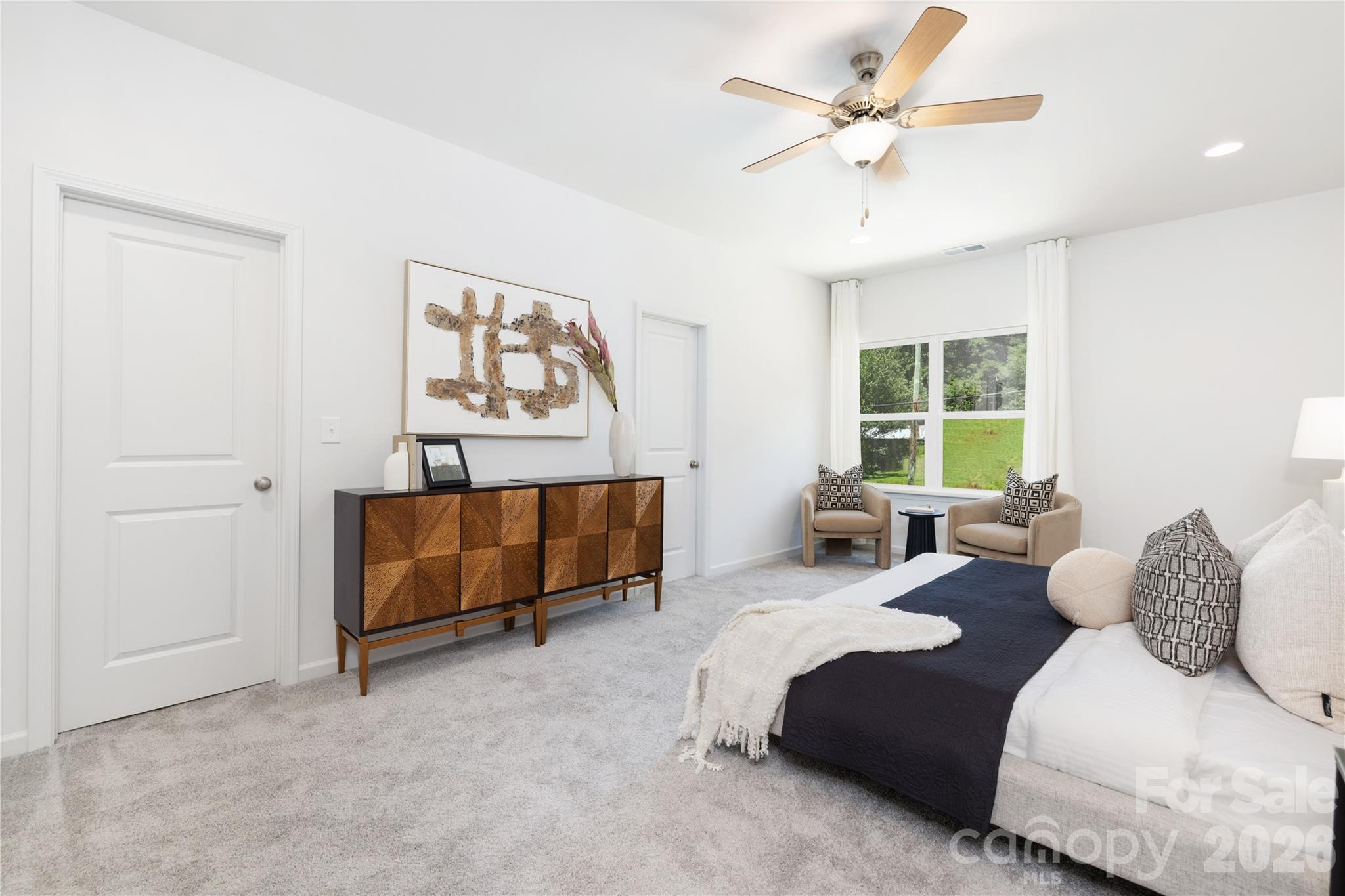 10606 Arlington Church Road Mint Hill, NC 28227 - Photo 15 of 26 a bedroom with furniture and a large window