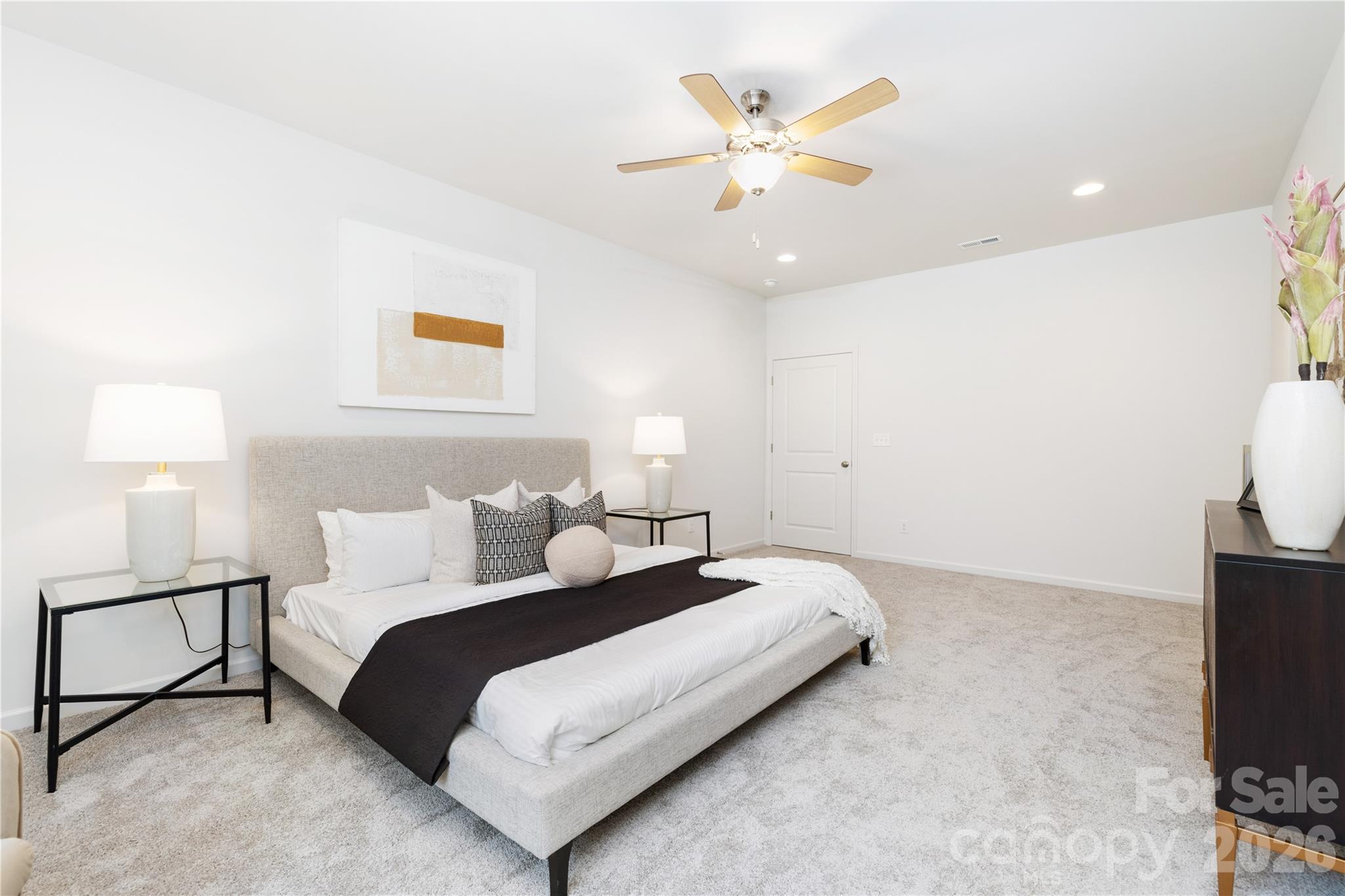 10606 Arlington Church Road Mint Hill, NC 28227 - Photo 17 of 26 a bedroom with a bed and a flat screen tv