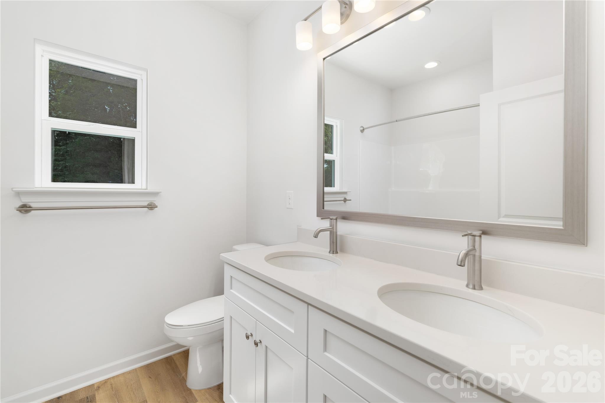 10606 Arlington Church Road Mint Hill, NC 28227 - Photo 21 of 26 a bathroom with a sink and a toilet