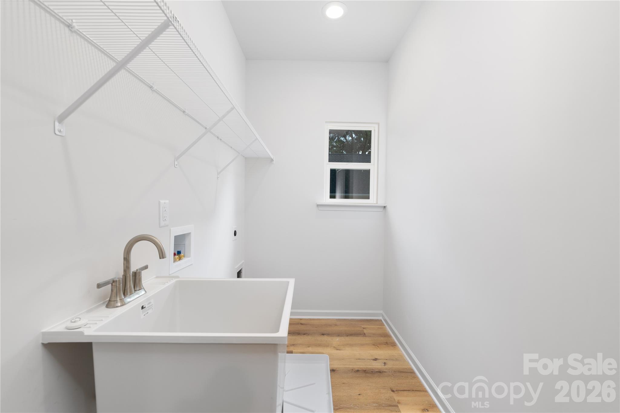 10606 Arlington Church Road Mint Hill, NC 28227 - Photo 23 of 26 a bathroom with a sink and a mirror