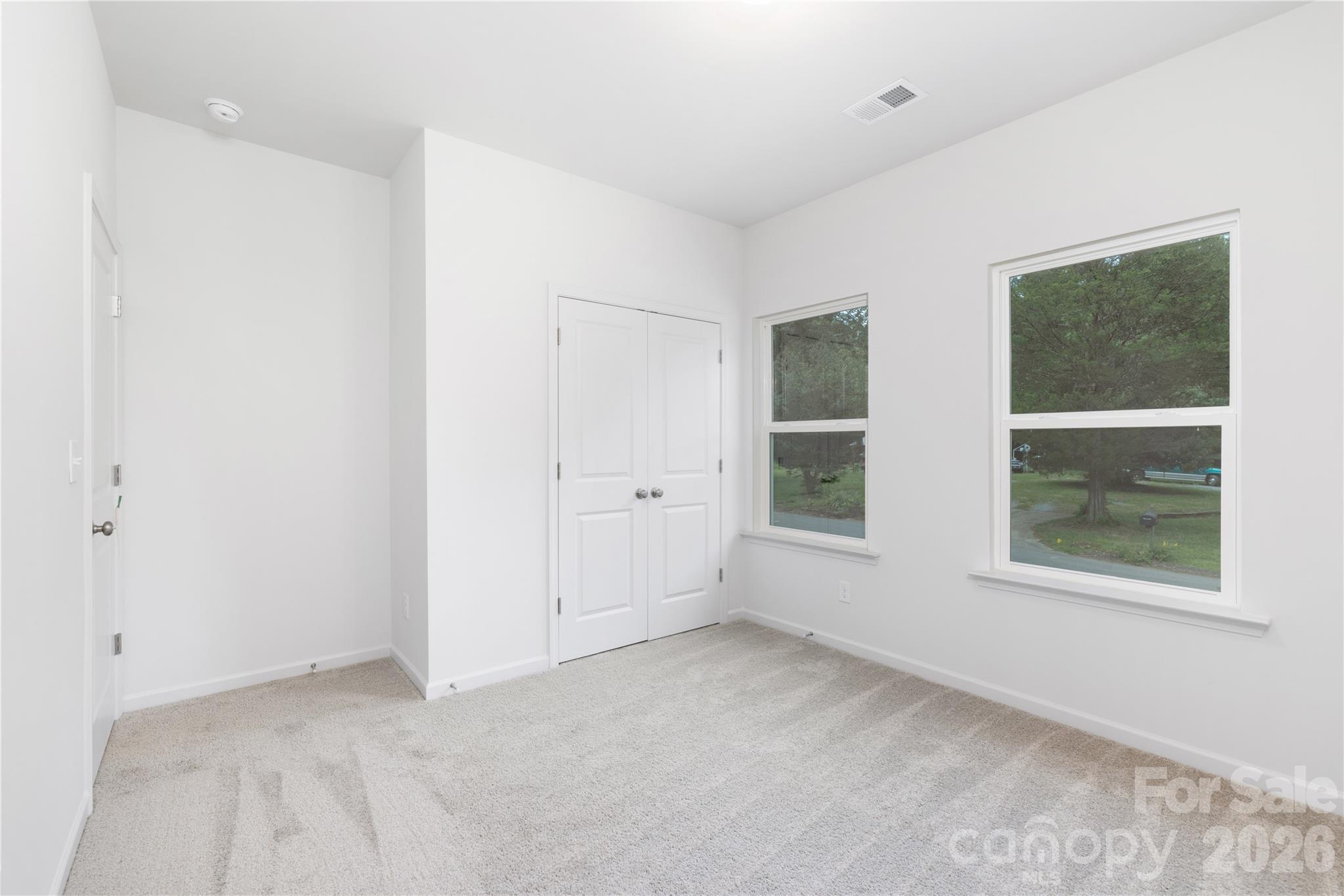 10606 Arlington Church Road Mint Hill, NC 28227 - Photo 24 of 26 an empty room with windows