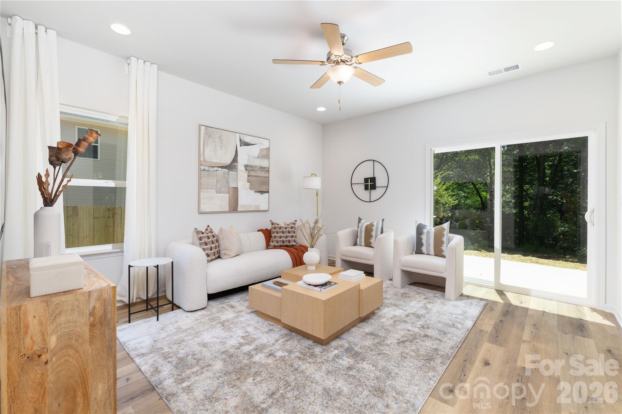 10606 Arlington Church Road Mint Hill, NC 28227 - Photo 7 of 26 a living room with furniture and a large window