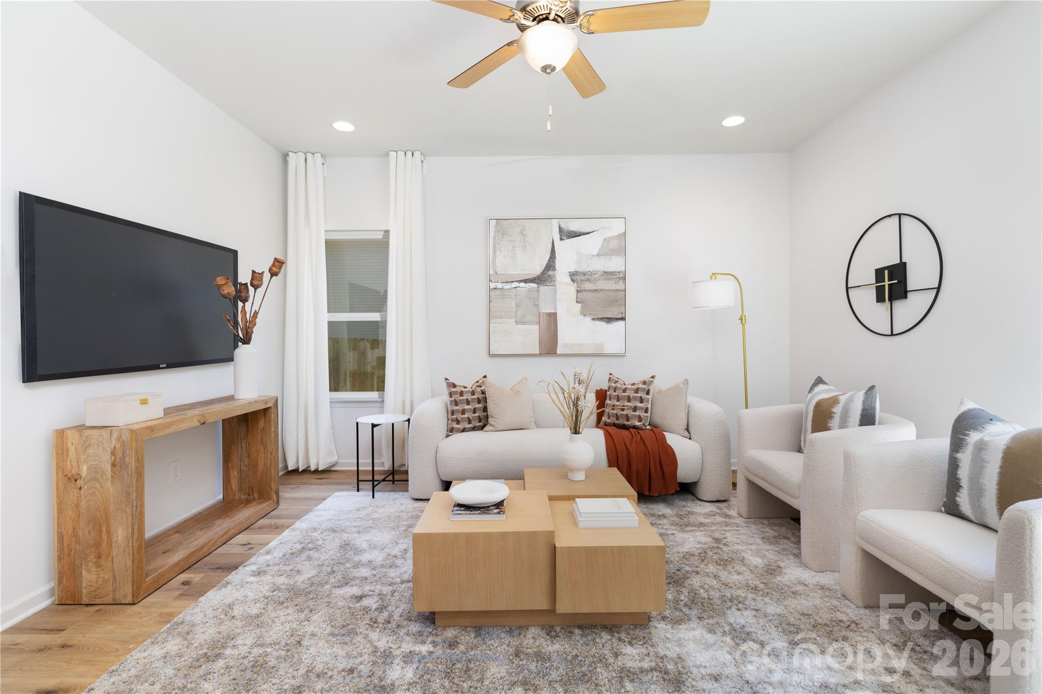 10606 Arlington Church Road Mint Hill, NC 28227 - Photo 8 of 26 a living room with furniture and a flat screen tv