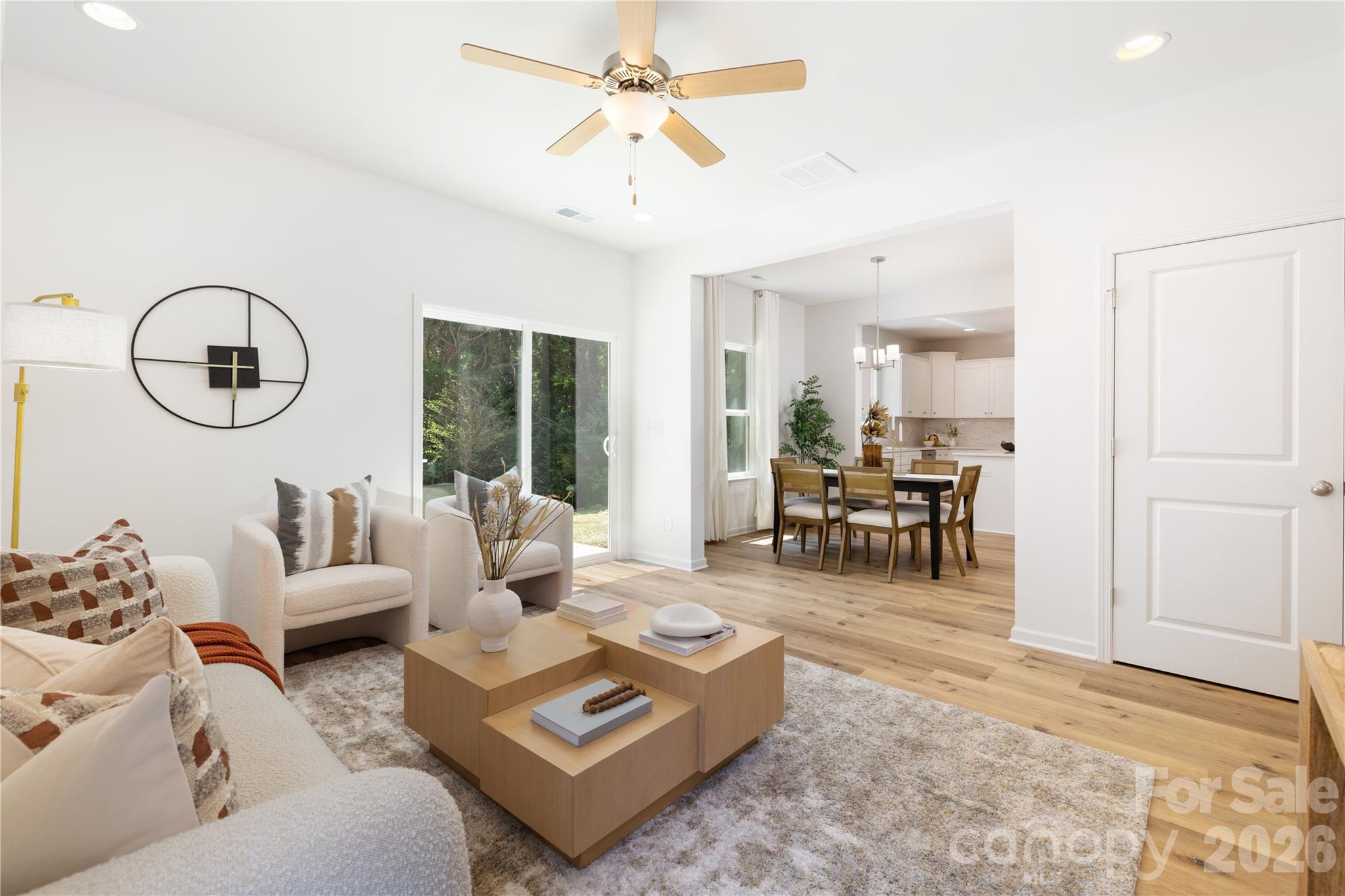 10606 Arlington Church Road Mint Hill, NC 28227 - Photo 9 of 26 a living room with furniture a dining table and a window