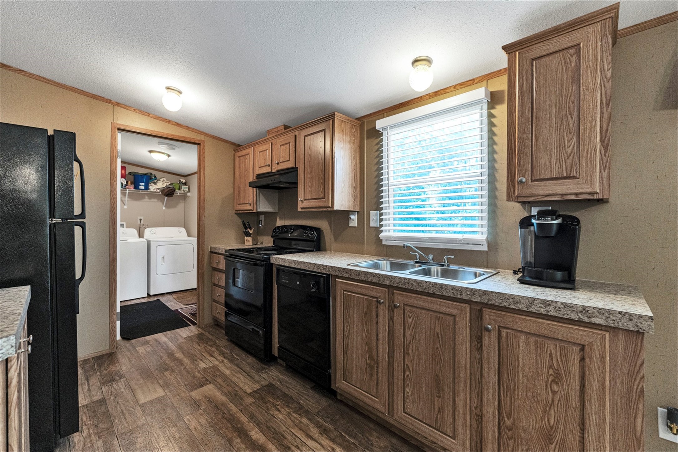 50 Fm 3179 Road Huntsville, TX 77320 - Photo 17 of 45 Open kitchen design keeps everyone connected while offering plenty of prep space and storage solutions.