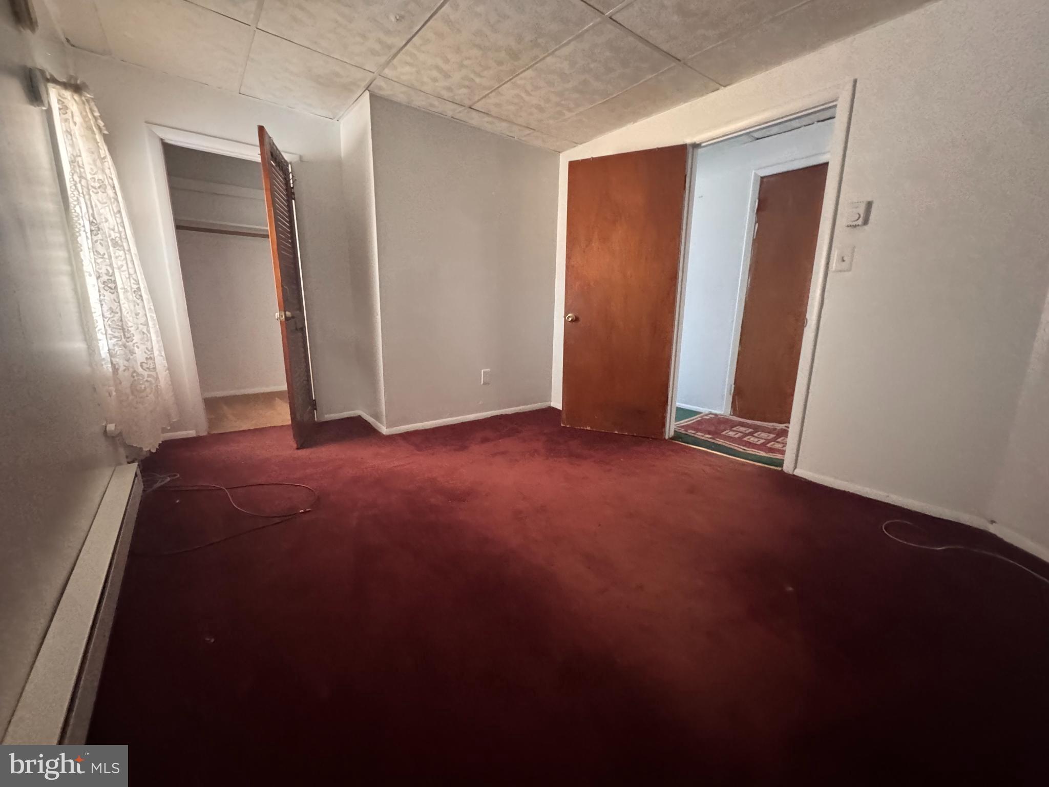 20436 Bowles Road Coltons Point, MD 20626 - Photo 12 of 14 an empty room with closet and mirror