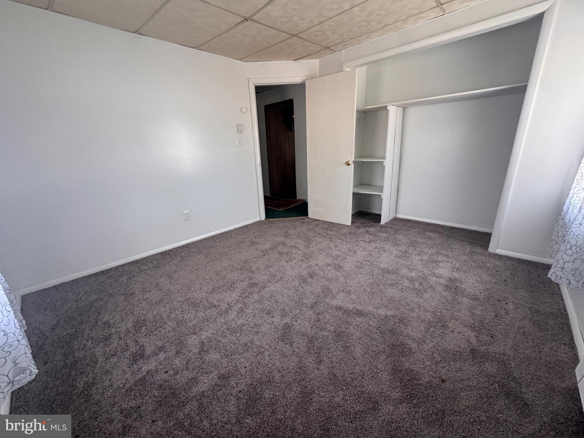 20436 Bowles Road Coltons Point, MD 20626 - Photo 4 of 14 an empty room with closet and windows