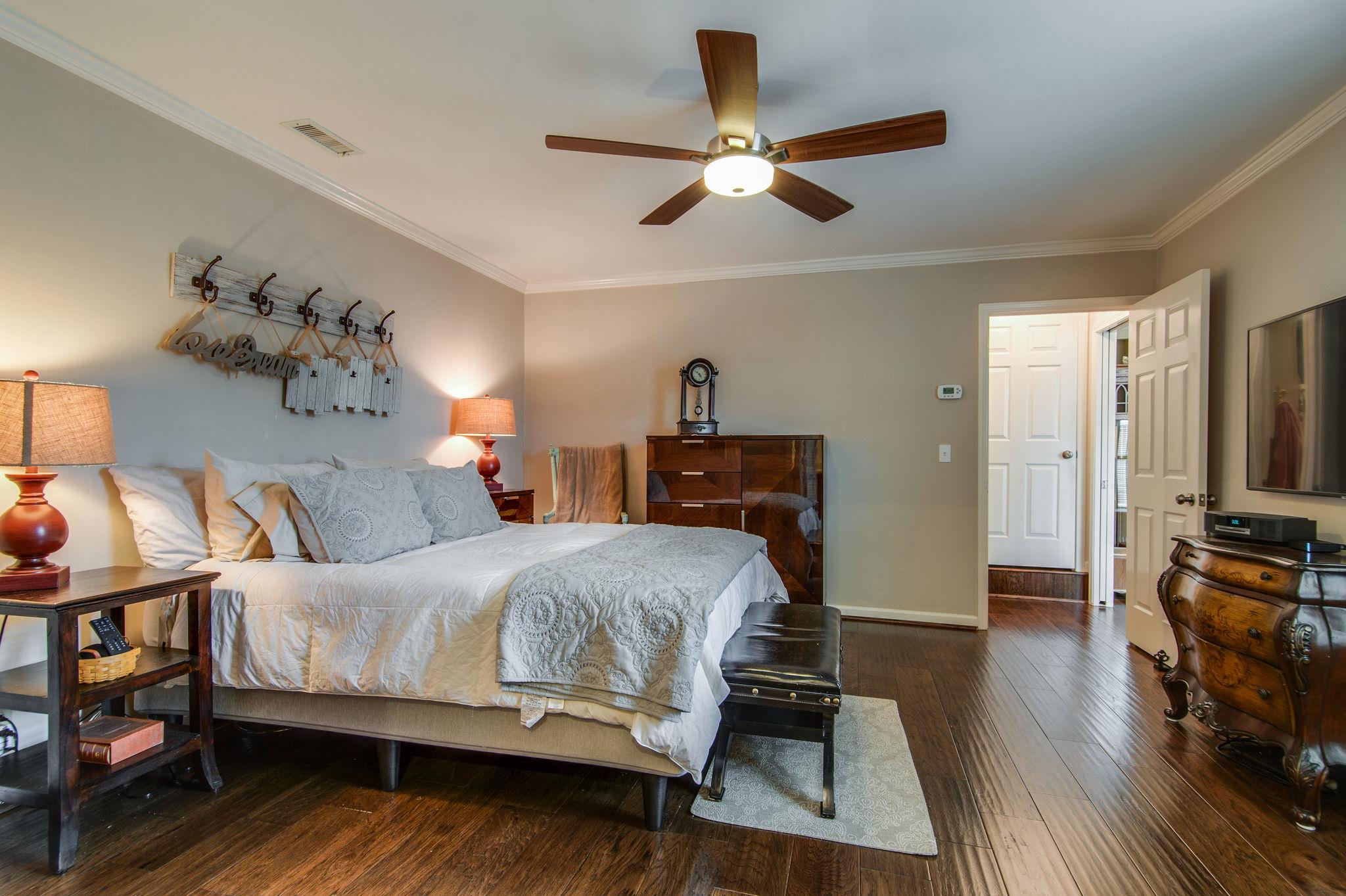 949 General George Patton Road Nashville, TN 37221 - Photo 11 of 25 a bedroom with a bed and a flat screen tv