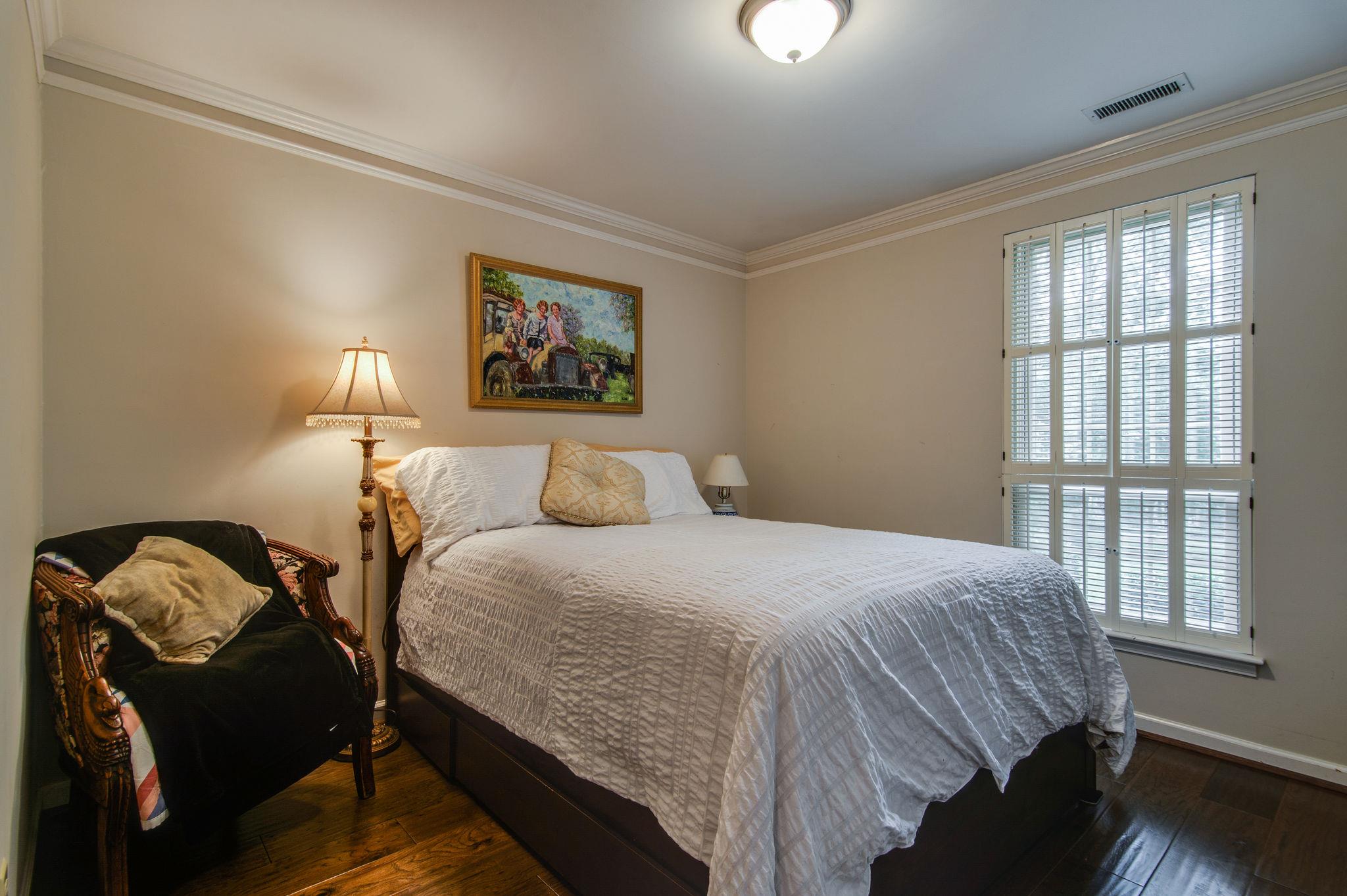 949 General George Patton Road Nashville, TN 37221 - Photo 17 of 25 a bedroom with a bed and a painting on the wall