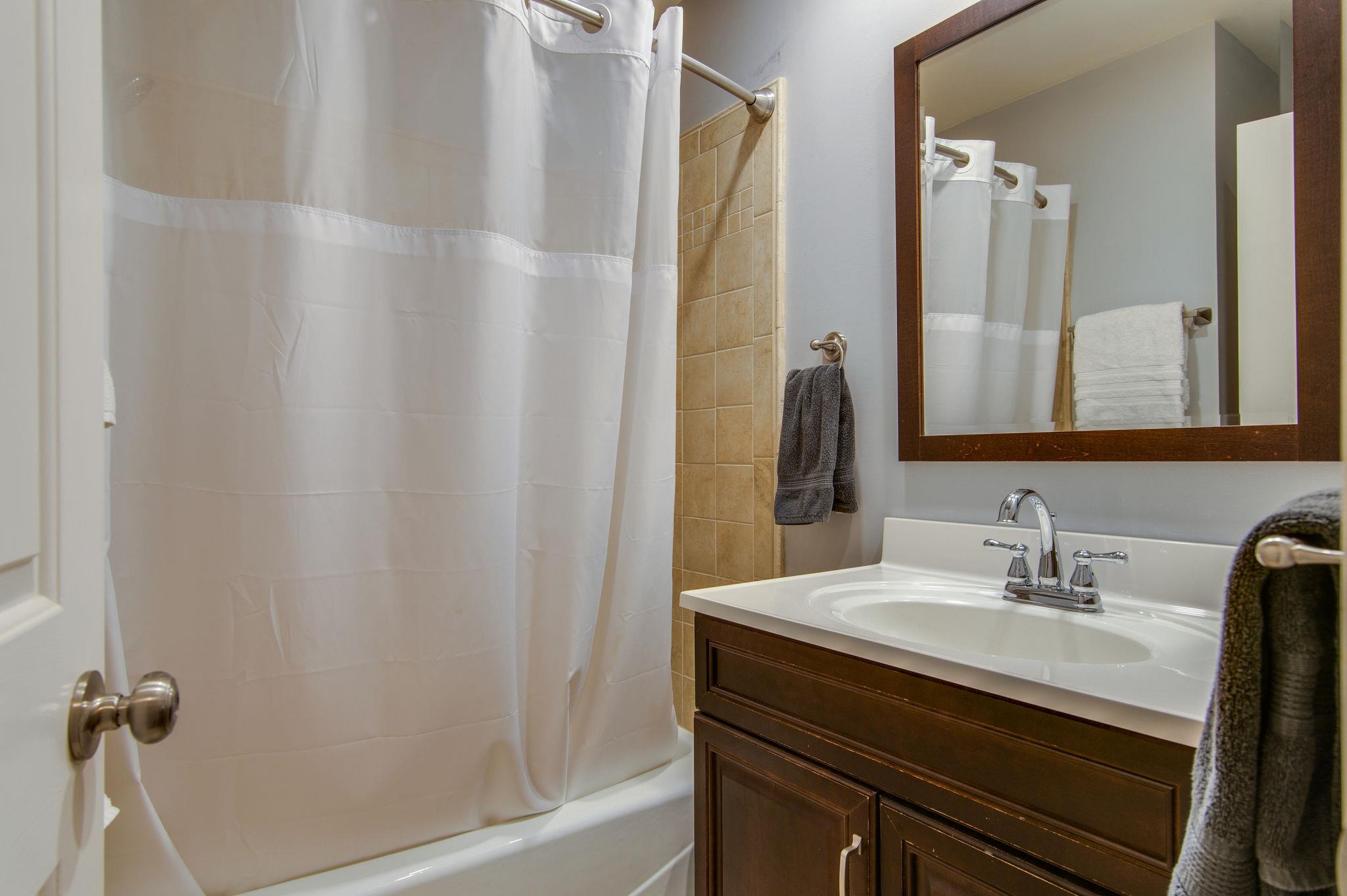 949 General George Patton Road Nashville, TN 37221 - Photo 18 of 25 a bathroom with a sink and a mirror
