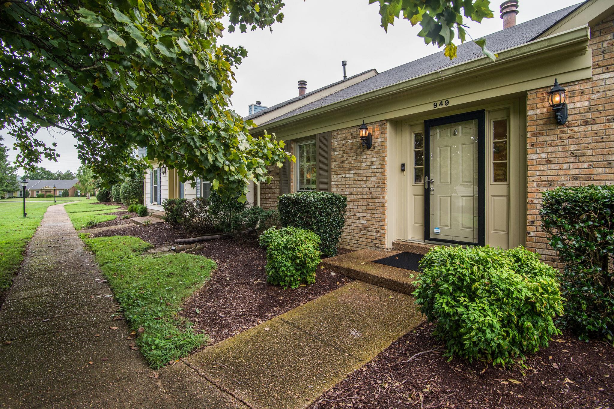 949 General George Patton Road Nashville, TN 37221 - Photo 3 of 25 a front view of a house with garden