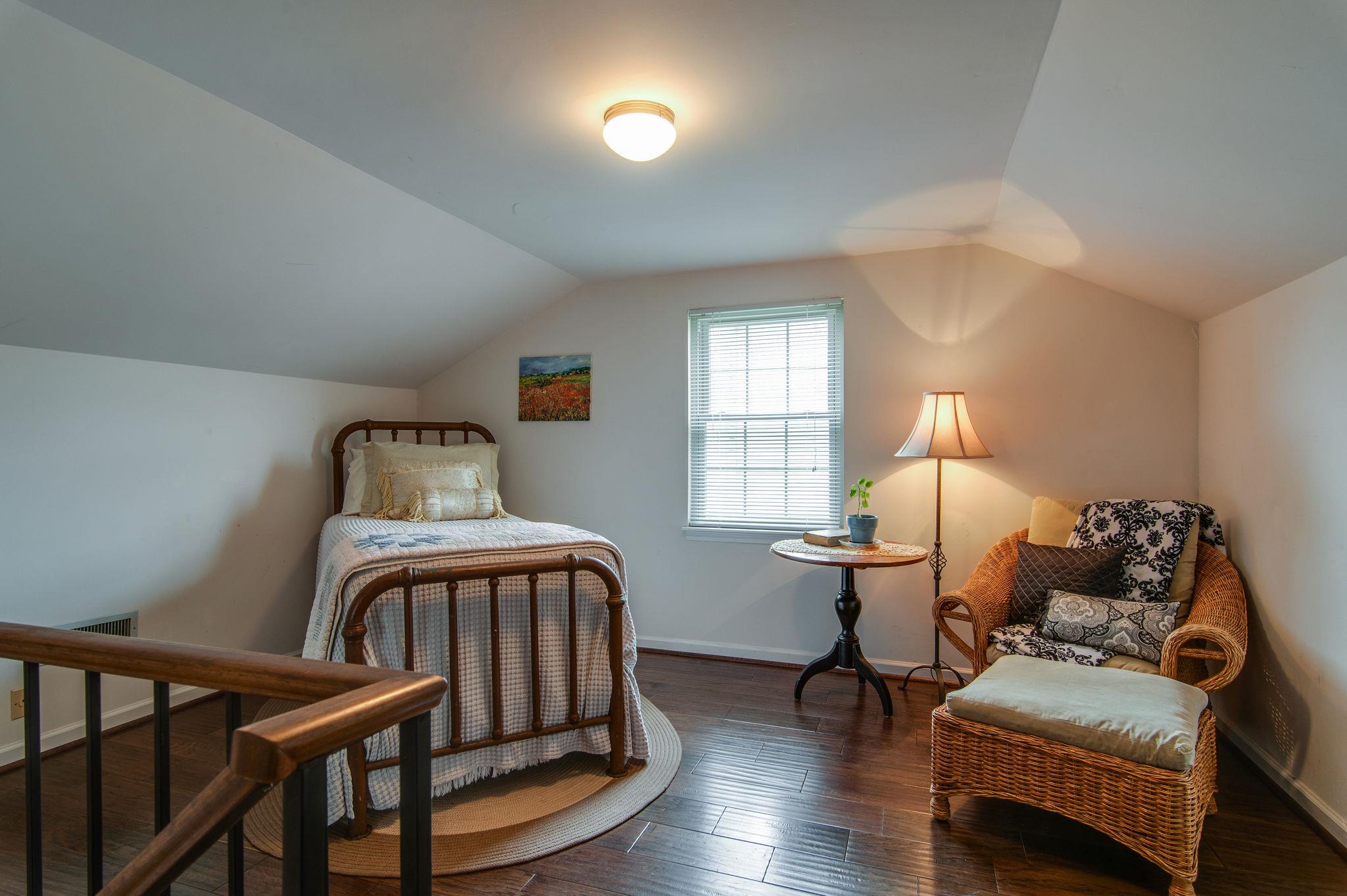 949 General George Patton Road Nashville, TN 37221 - Photo 21 of 25 a bedroom with furniture and a window