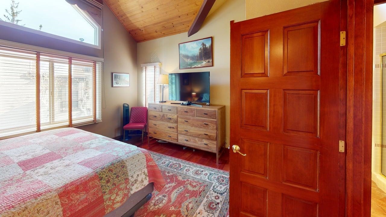3600 Chateau Road, Unit 2 Mammoth Lakes, CA 93546 - Photo 11 of 27 Bedroom with ensuite bath, a wood ceiling with exposed beams, light wood-type flooring, and high vaulted ceiling
