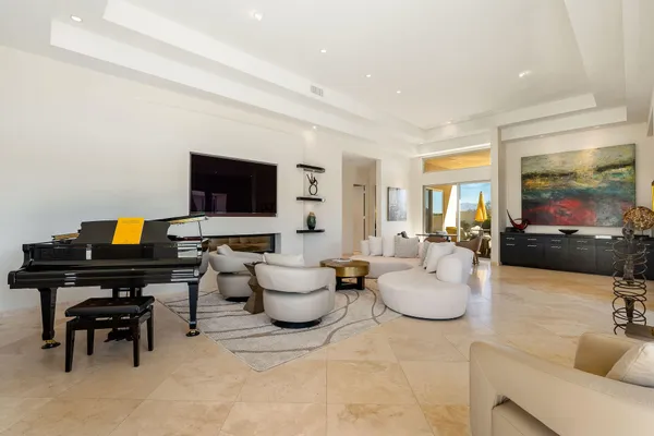 a living room with couch and a floor to ceiling window