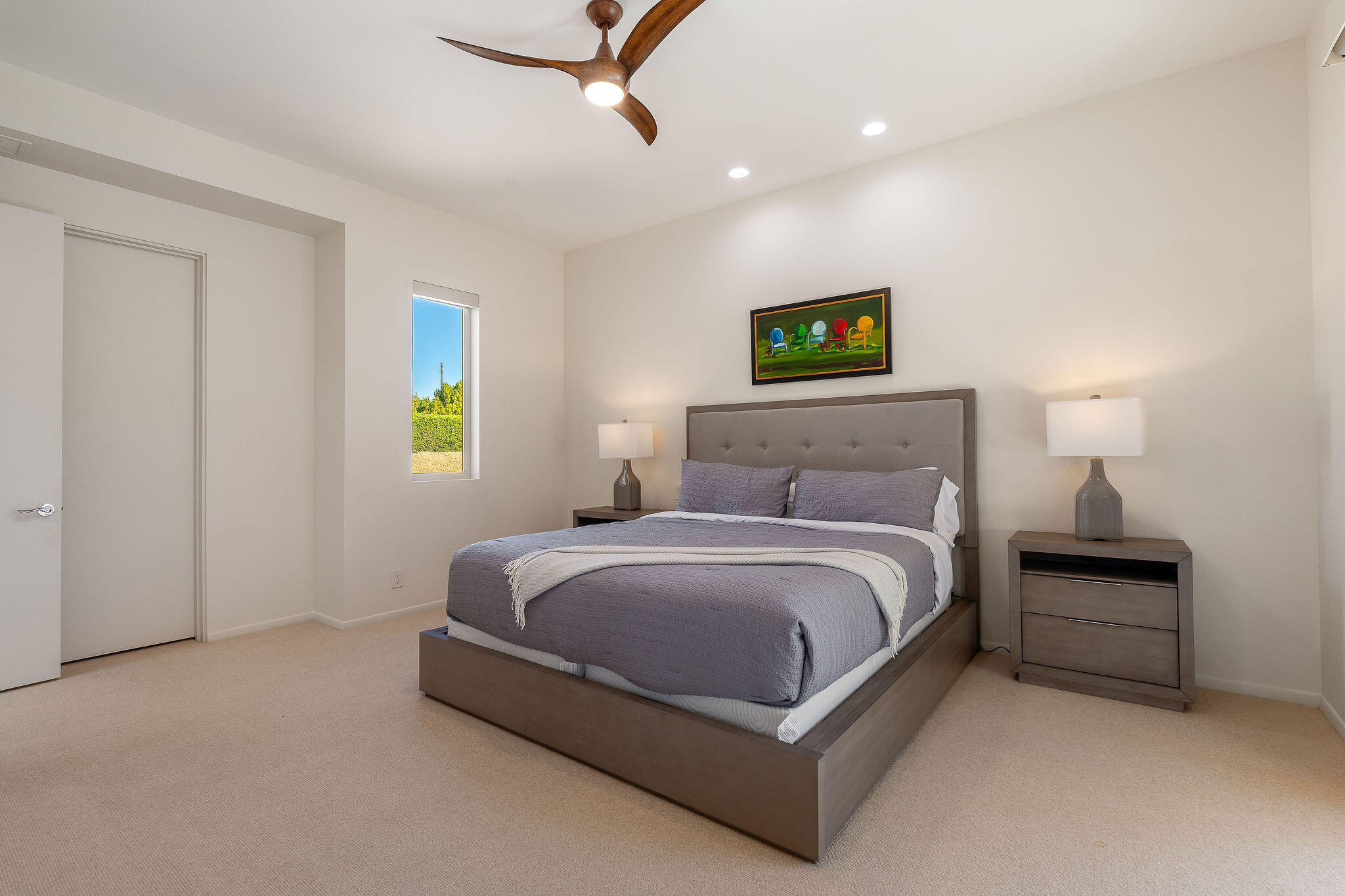 16 Judd Terrace Rancho Mirage, CA 92270 - Photo 30 of 31 a spacious bedroom with a bed and painting on the wall