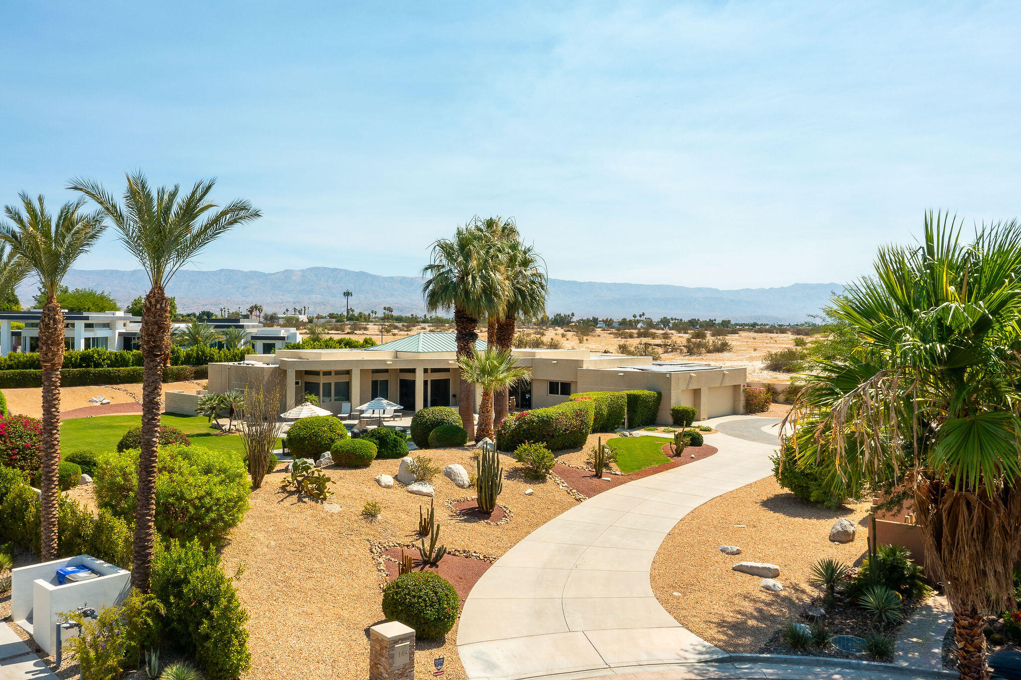16 Judd Terrace Rancho Mirage, CA 92270 - Photo 3 of 31 a view of a swimming pool and a chairs