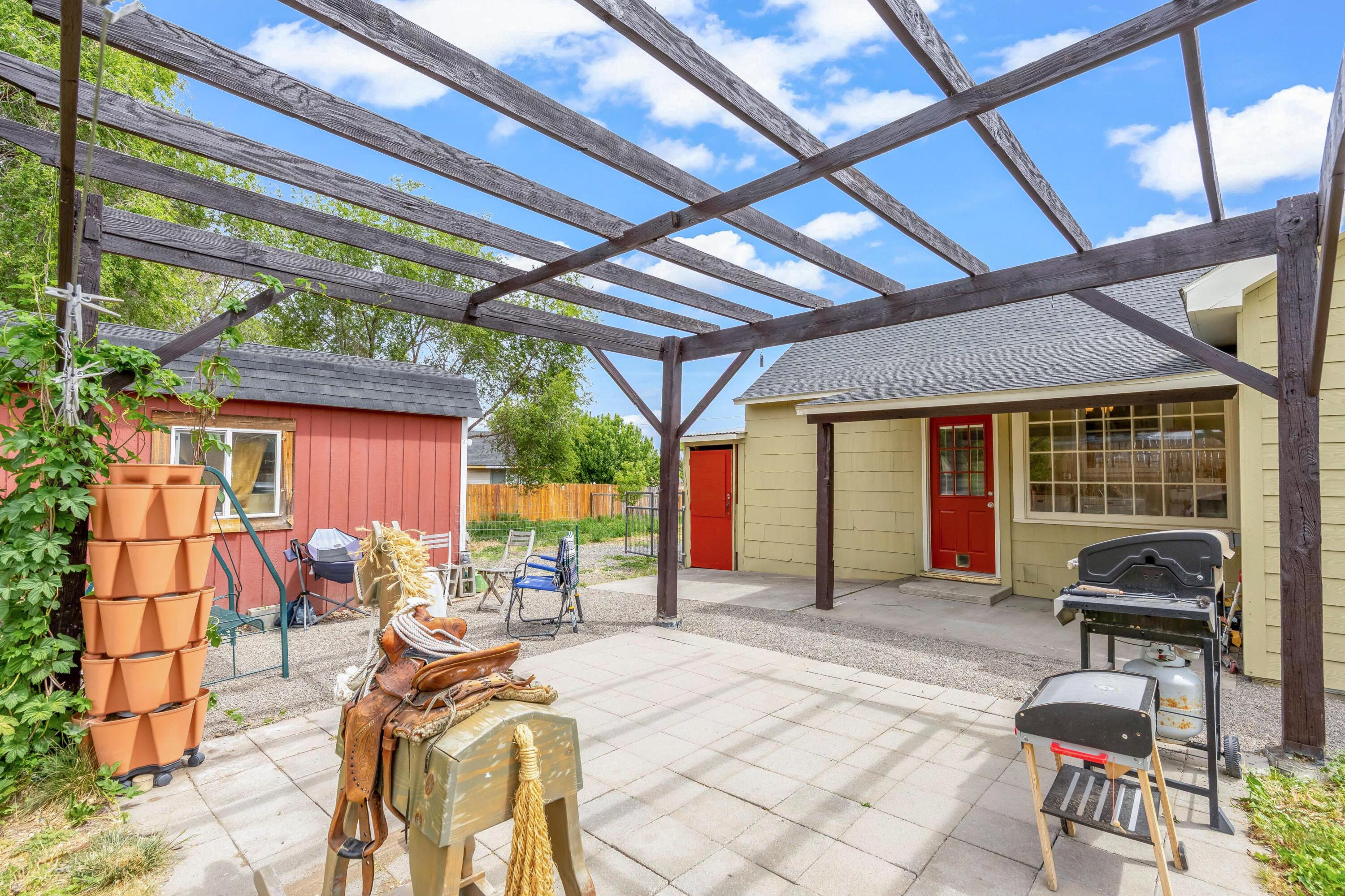 496 Southwest 2nd Street Madras, OR 97741 - Photo 25 of 37 a view of a house with patio outdoor seating