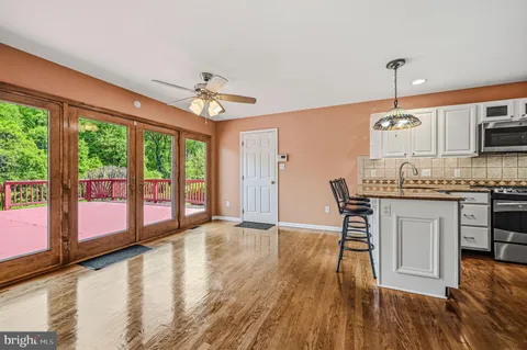 a dining room with furniture window wooden floor