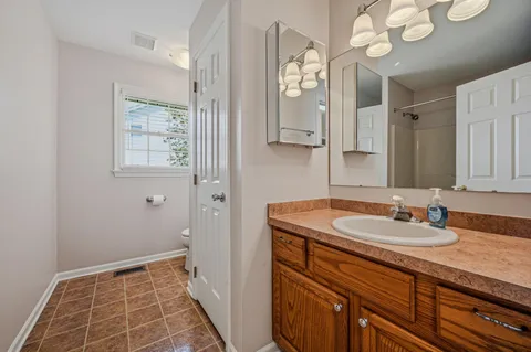 a bathroom with a sink a vanity and a mirror