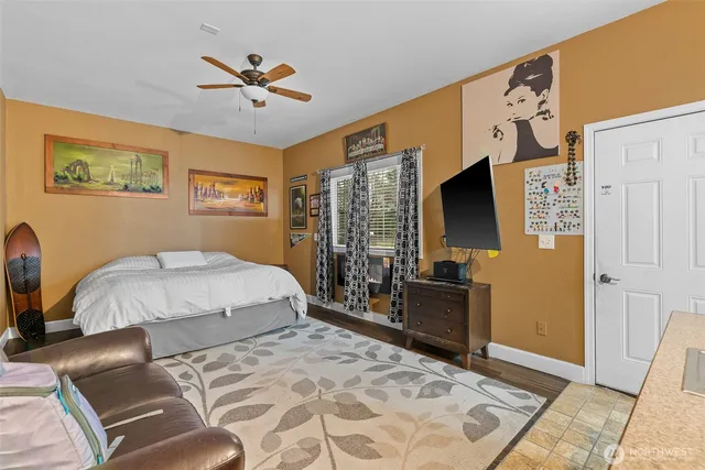 a bedroom with a bed and dresser