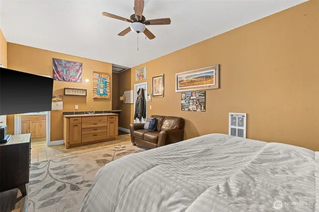 a bedroom with a bed and dresser