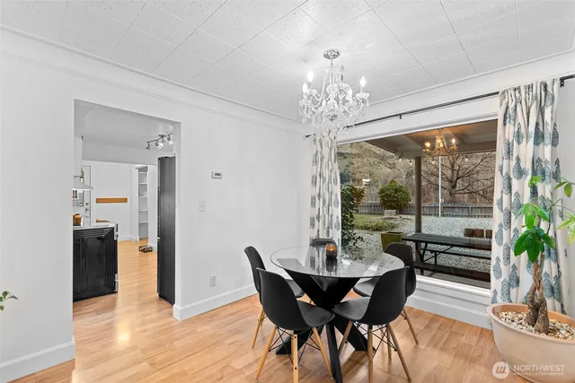 a view of a dining room with furniture window and wooden floor