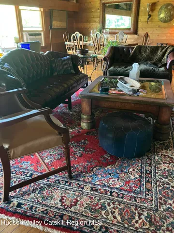 a living room with furniture and a table