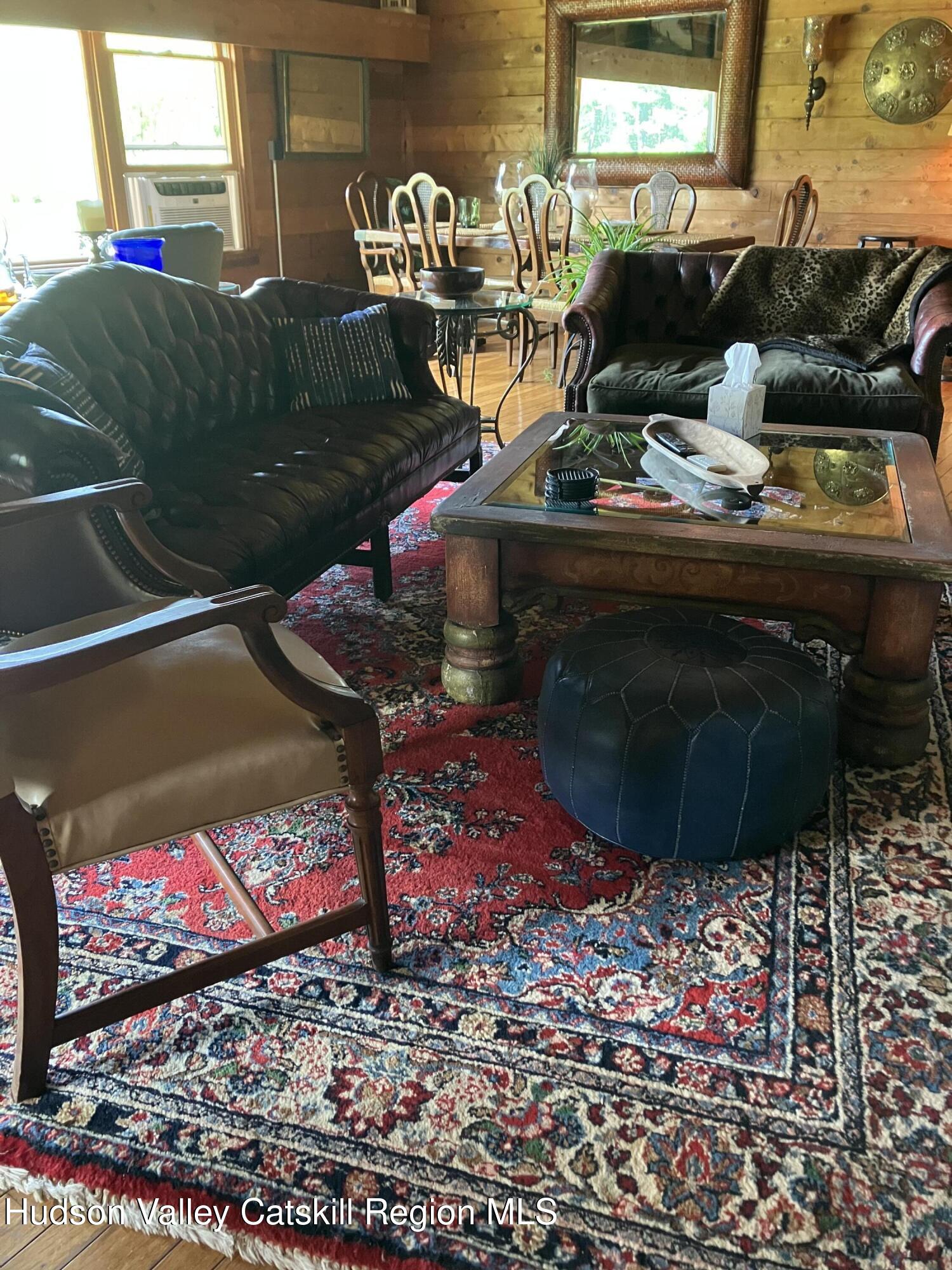 287 Game Farm Road Catskill, NY 12414 - Photo 16 of 33 a room with lots of different colored cloths