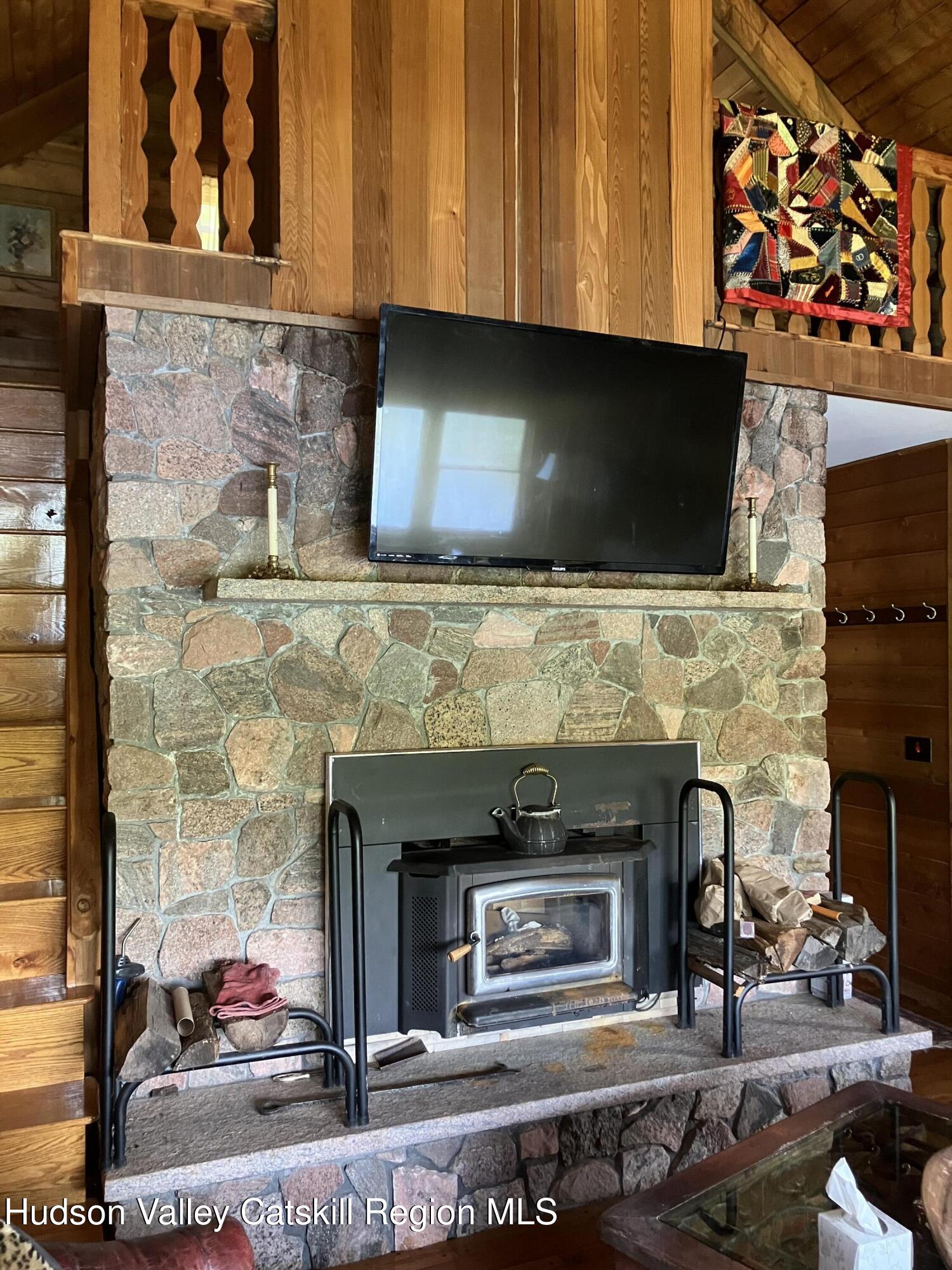 287 Game Farm Road Catskill, NY 12414 - Photo 19 of 33 a living room with fireplace furniture and a fireplace