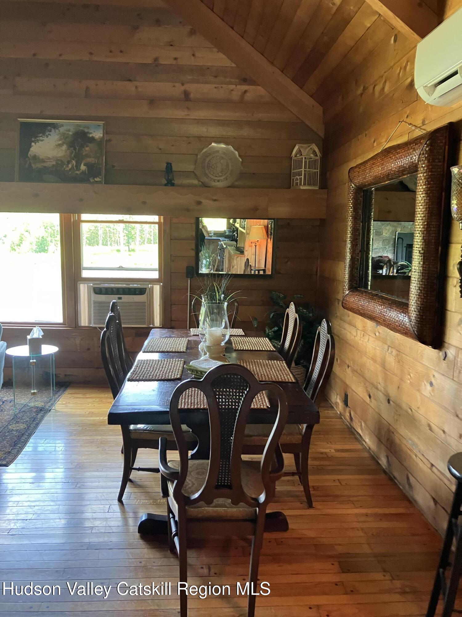 287 Game Farm Road Catskill, NY 12414 - Photo 22 of 33 a view of a dining room with furniture window and wooden floor