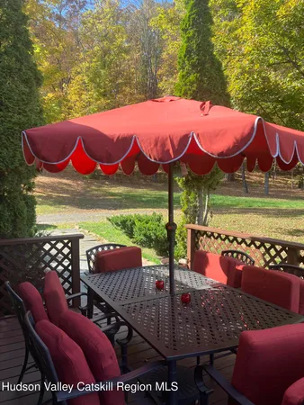 a view of a patio with a table and chairs