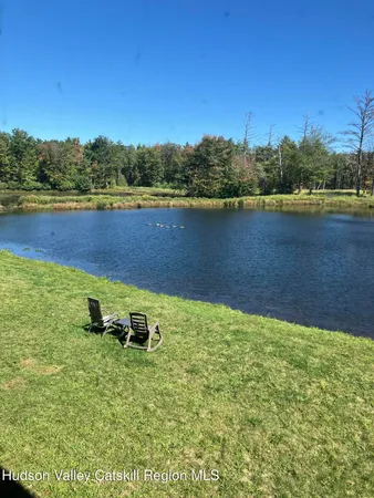 a view of a lake with a big yard
