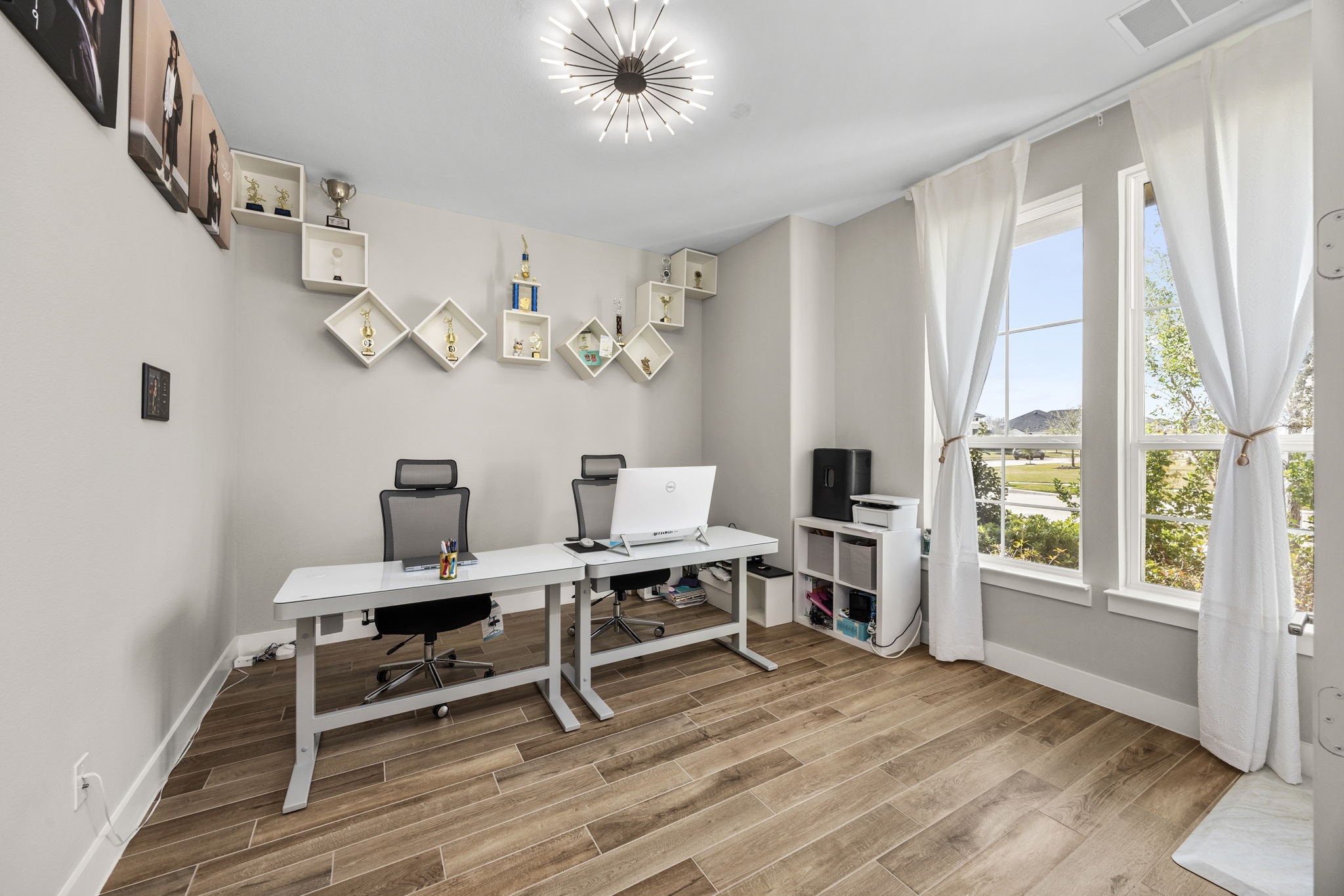 29402 Cir S Rnch Trail Fulshear, TX 77406 - Photo 11 of 50 a view of a workspace with furniture and a window