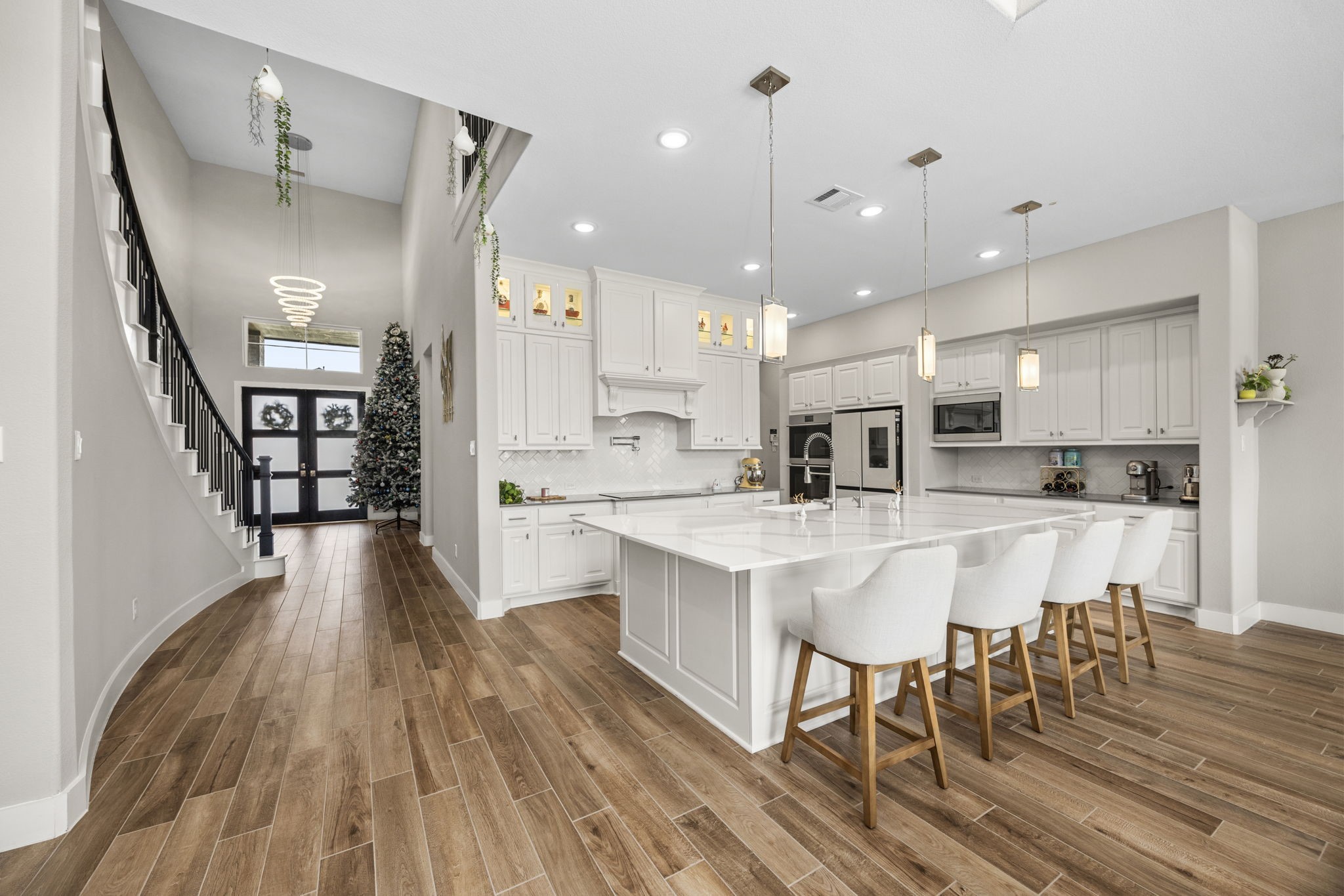 29402 Cir S Rnch Trail Fulshear, TX 77406 - Photo 15 of 50 a large kitchen with a table and chairs