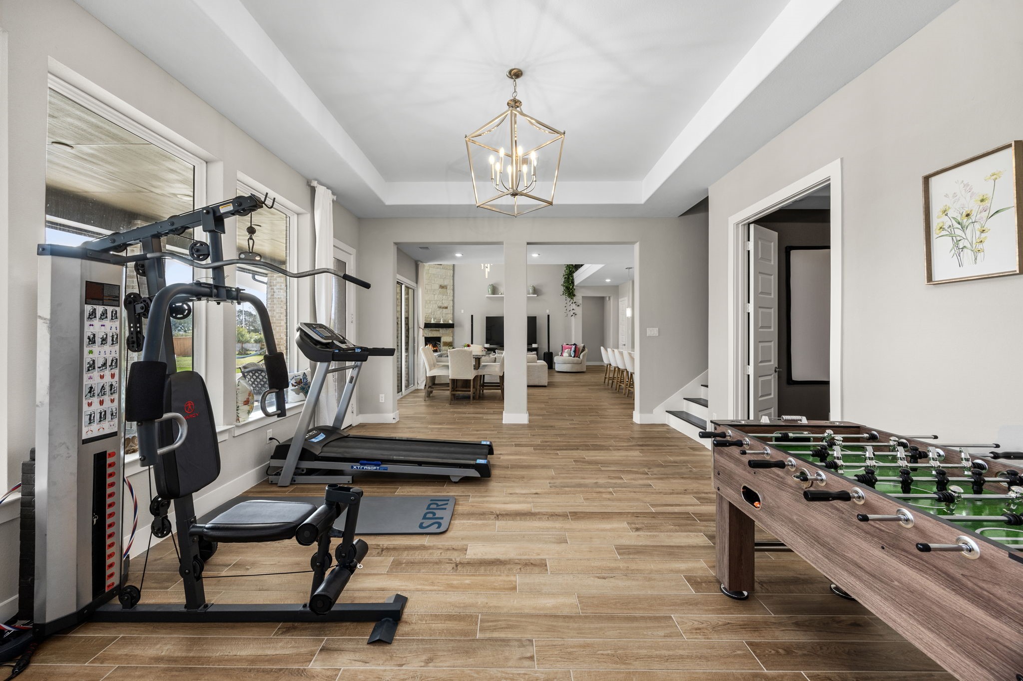 29402 Cir S Rnch Trail Fulshear, TX 77406 - Photo 21 of 50 a living room with lots of furniture and a chandelier