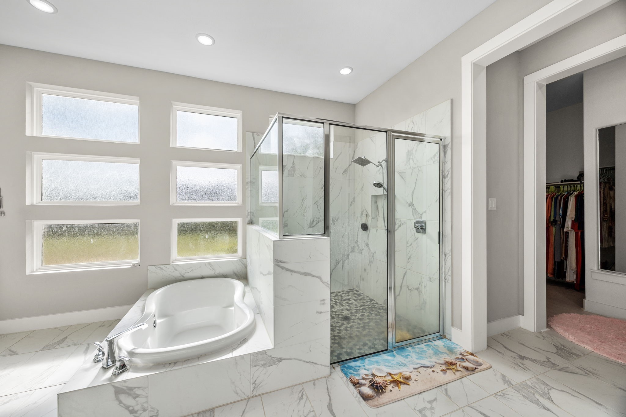29402 Cir S Rnch Trail Fulshear, TX 77406 - Photo 29 of 50 a bathroom with a granite countertop sink a mirror a bathtub and next to a window