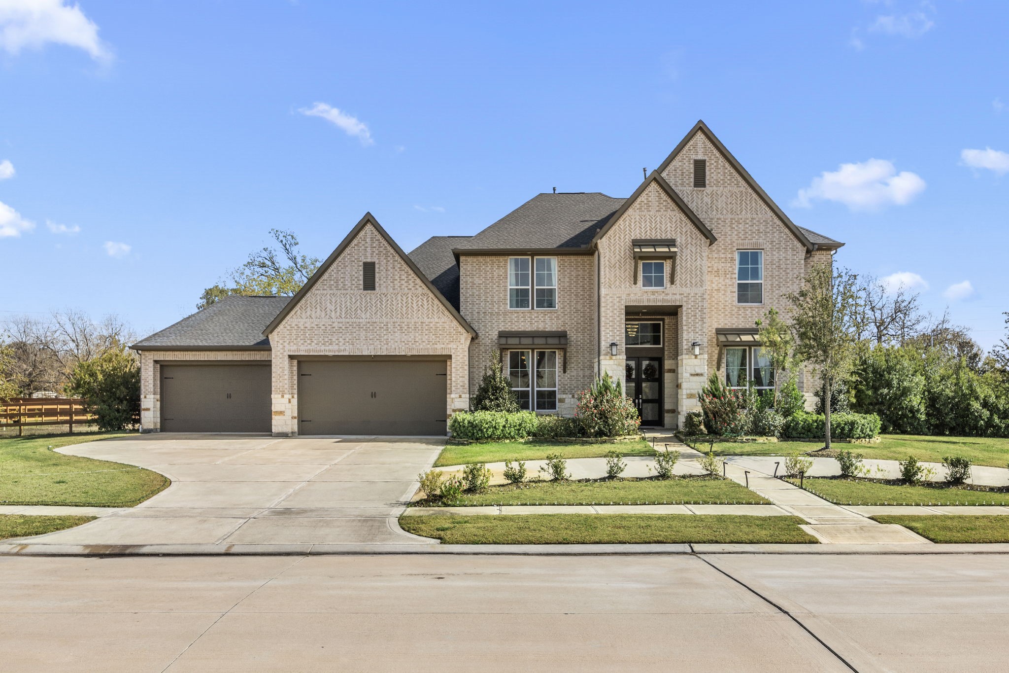 29402 Cir S Rnch Trail Fulshear, TX 77406 - Photo 3 of 50 a front view of a house with a yard table and chairs