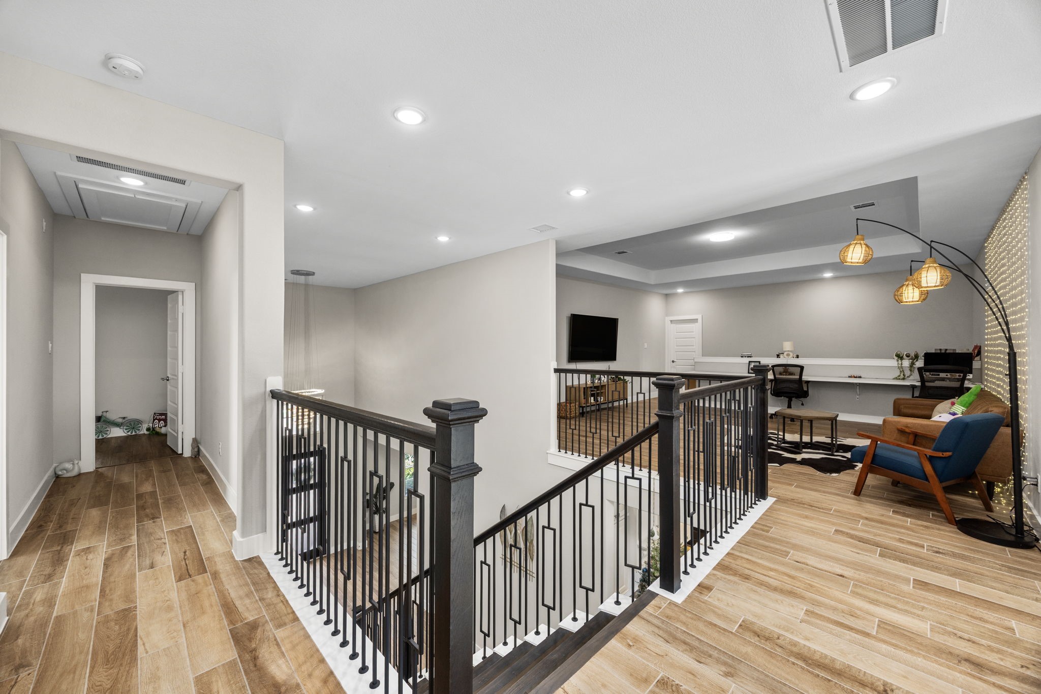 29402 Cir S Rnch Trail Fulshear, TX 77406 - Photo 36 of 50 a view of a hallway with wooden floor and stairs