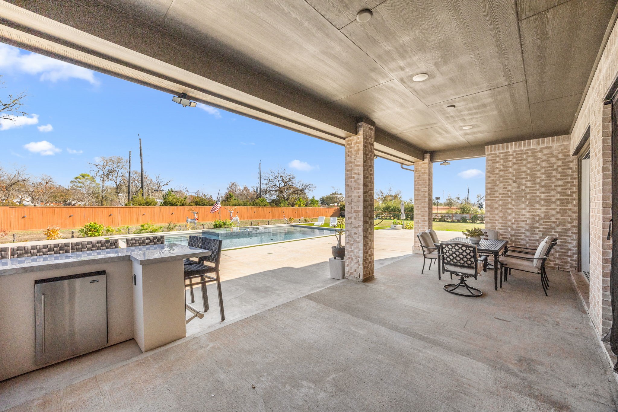 29402 Cir S Rnch Trail Fulshear, TX 77406 - Photo 45 of 50 a view of a patio with a table and chairs